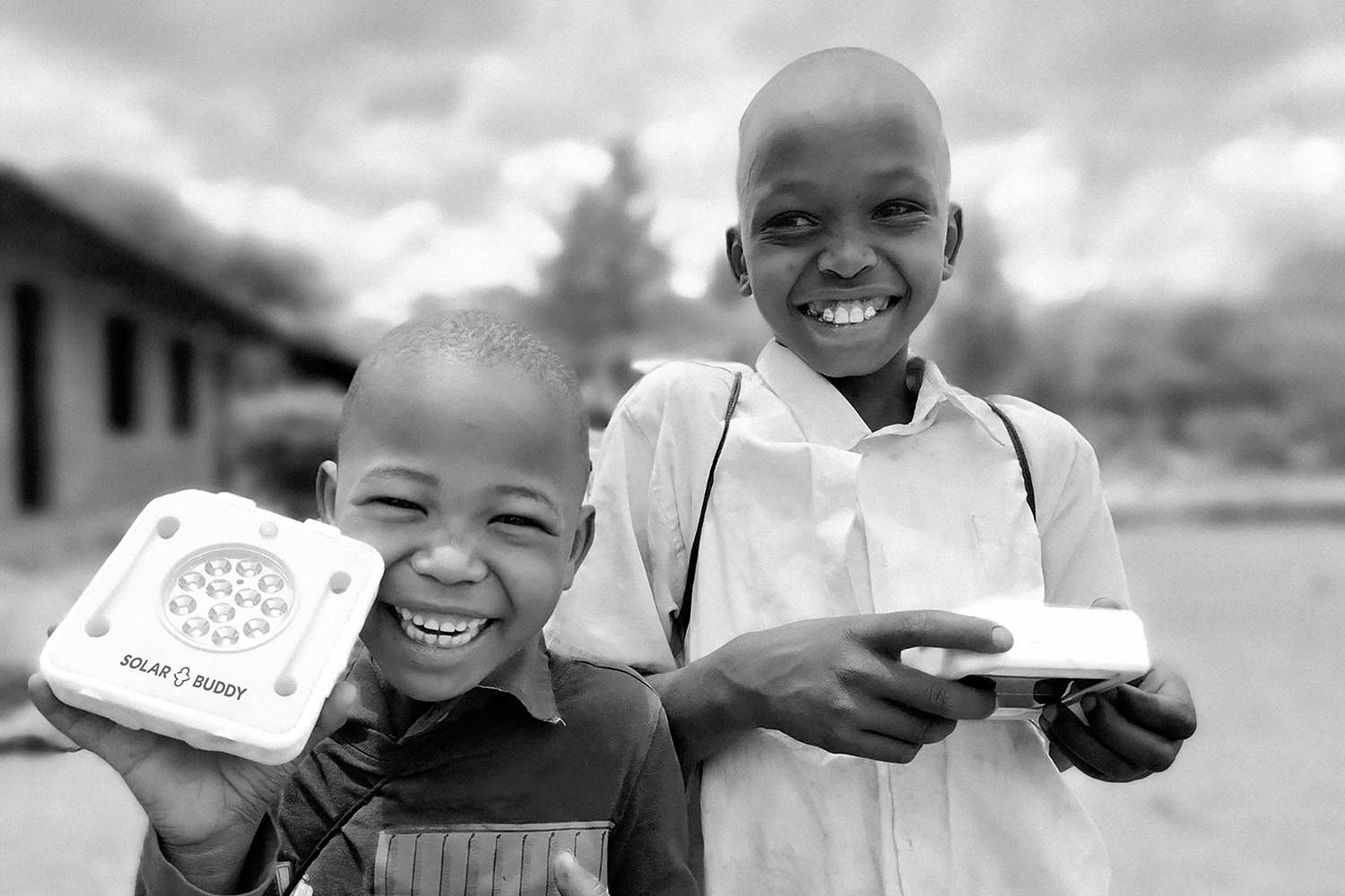 Young students in Africa happy receiving their lights